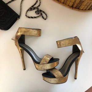 Michael Antonio gold ankle strap platform heels